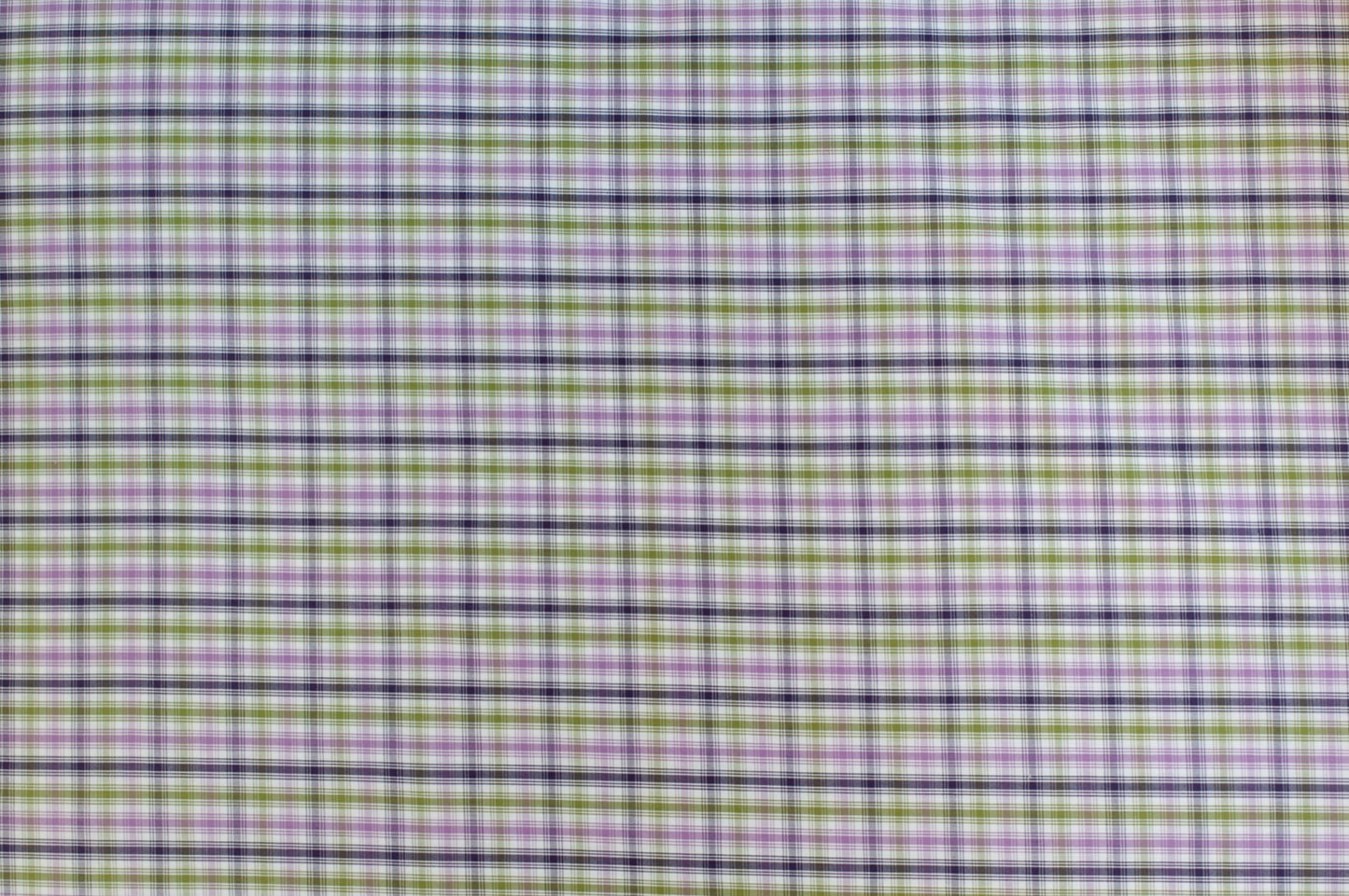 Organic yarn-dyed cotton fabric featuring soft purple, olive green, navy, and ivory plaid check pattern with lightweight woven texture.