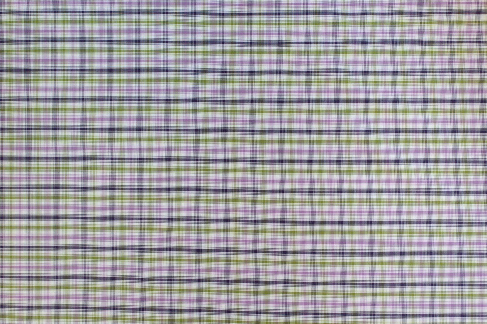 Organic yarn-dyed cotton fabric featuring soft purple, olive green, navy, and ivory plaid check pattern with lightweight woven texture.