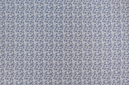 Organic cotton fabric with delicate blue ditsy floral print on ivory background, vintage inspired lightweight sewing fabric.