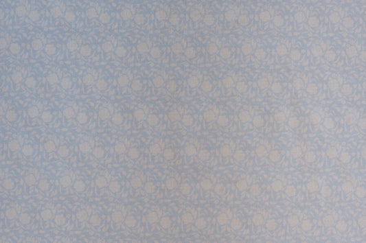Organic cotton cambric fabric featuring delicate powder blue cabbage rose floral vine print on soft ivory background.